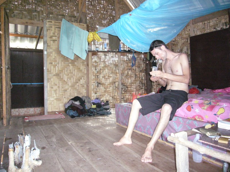 Lower left corner: the bamboo root candelabra. Top right corner: The mosquito net support doubles as a banana hanger.